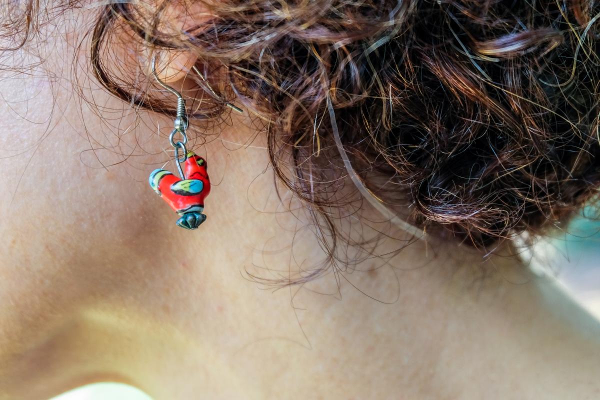 Close-up of Michelle's chicken earring