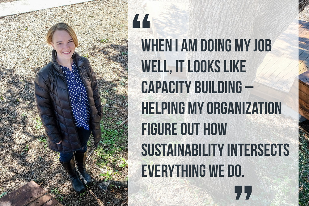 Susan Peterson standing in a black coat and blue and white polka dot shirt with black boots and jeans. A quote next to her reads, "When I am doing my  job well, it looks like capacity building - helping my organization figure out how sustainability intersects everything we do."